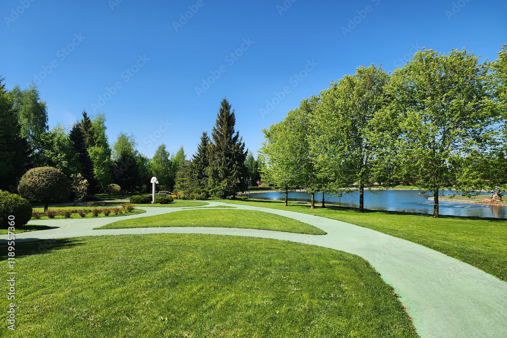 custom made wallpaper toronto digitalA park area with picturesque landscaping and winding paths by a serene lake on a sunny .summer day.
