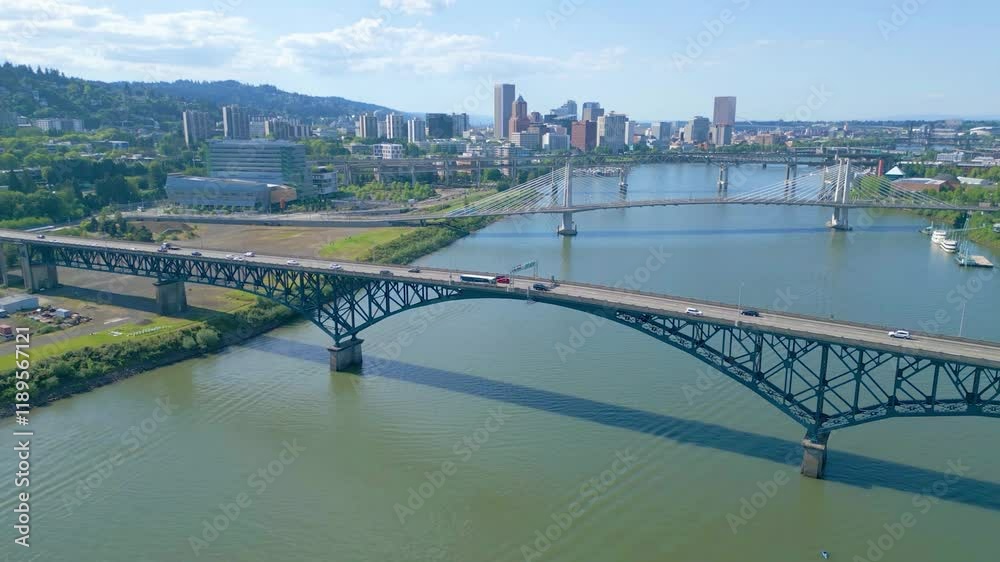 downtown Portland, Oregon on sunny day with Ross Island Bridge and Tillicum Crossing bridge
