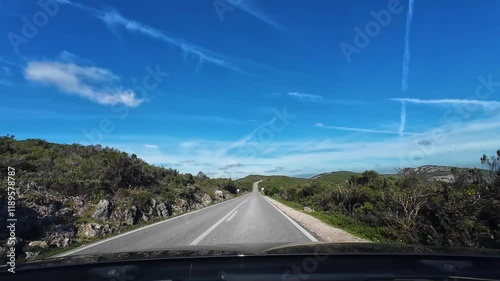 Driving Car on Scenic Road in Arrabida Natural Park on Sunny Day. Portugal photo