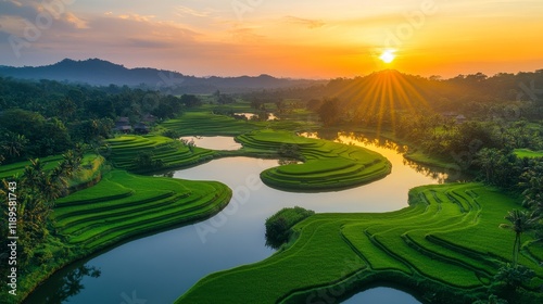 Golden sunset over terraced rice fields with mist in mountain valley