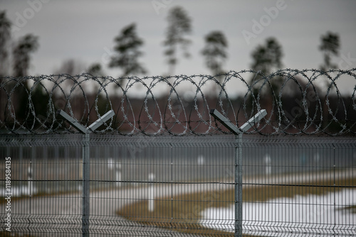 Fotografía Perimeter fence crossing security for intruders to not cross its limitations