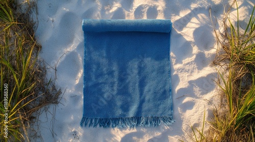Relaxing on a blue blanket on the sandy beach during sunset with gentle waves...
