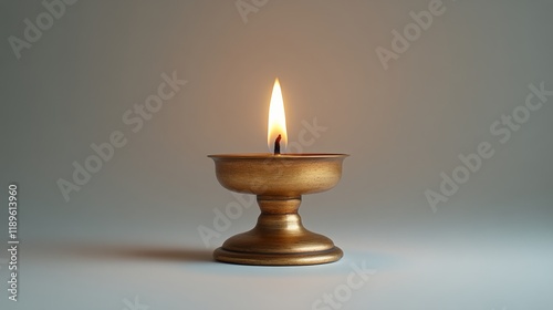 Ornate oil lamp illuminating a warm, soft background in a serene environment