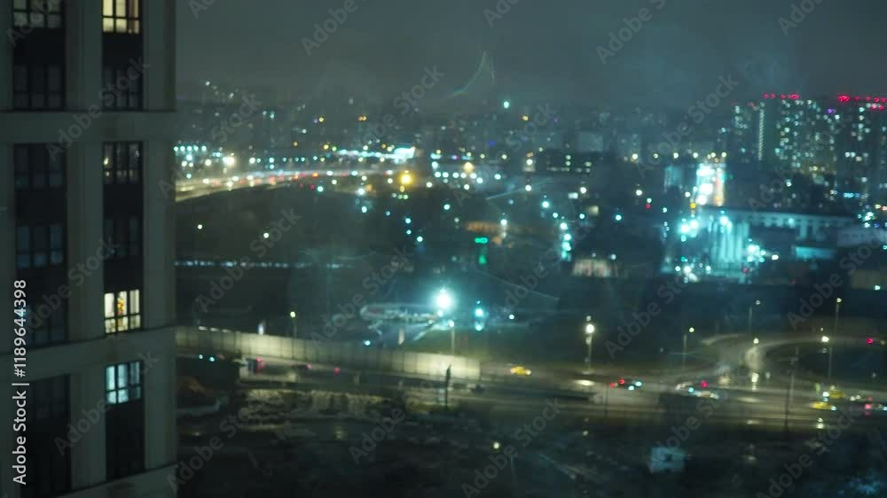 raindrops on the window against the blurred background of the night city bokeh effect