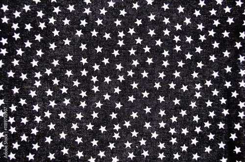 Full frame close-up of black fabric with small white stars