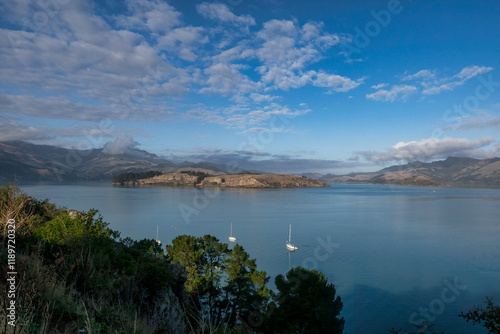 Views of the harbour with yachts moored viewed from the rolling hills of  Banks Peninsula Christchurch photo