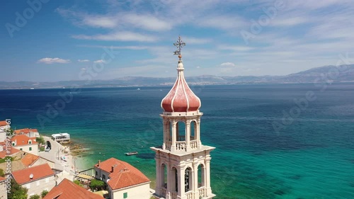 Sutivan, Croatia - Daytime Aerial Of Church Bell Tower. Stunning Close-Up Drone Footage Of The Church Bell Tower In Sutivan On Brač Island, Croatia, Highlighting Its Architecture And Surrounding Villa
