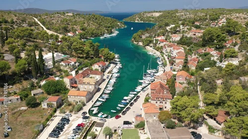 A scenic aerial view of Bobovisca Bay, Croatia, showcasing the entire bay with its crystal-clear waters and surrounding greenery. Bobovisca’s natural beauty is perfectly captured from the sky. photo