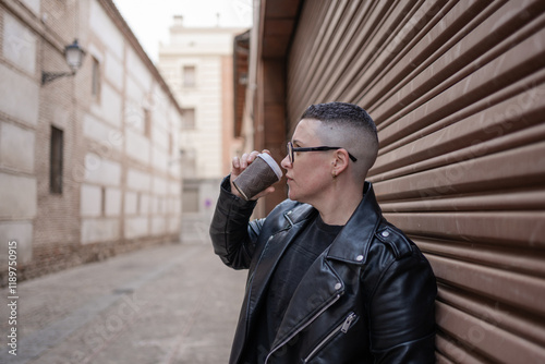 Lesbian woman drinking coffee in urban setting expressing masculinity