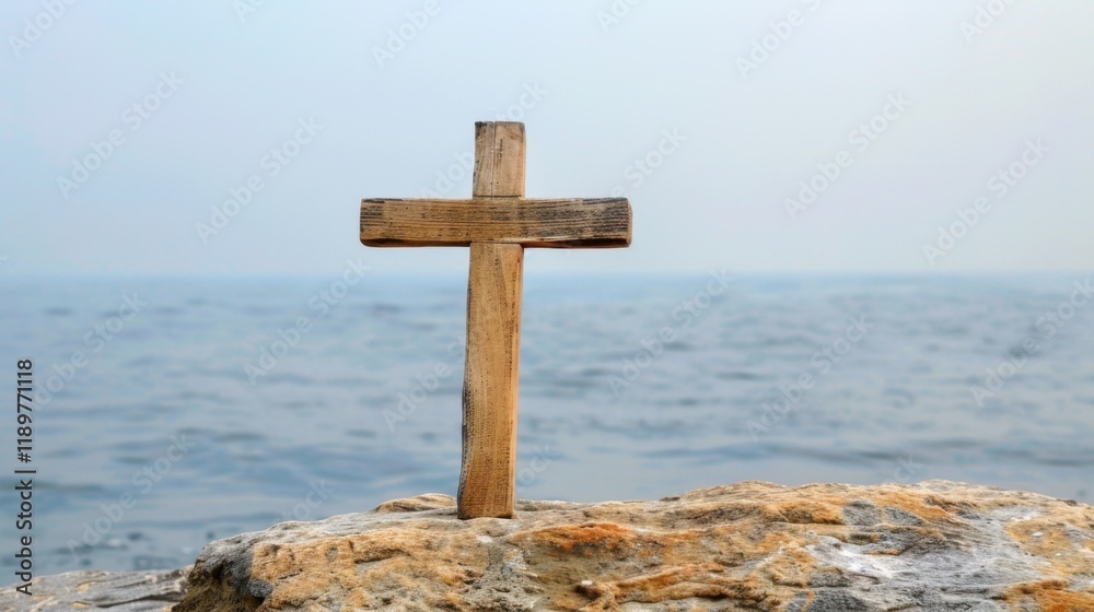 wooden cross stands on rock by water, symbolizing faith and spirituality. serene background of ocean enhances peaceful atmosphere wooden cross stands on rock by water, symbolizing faith and spirituality. serene background of ocean enhances peaceful atmosphere