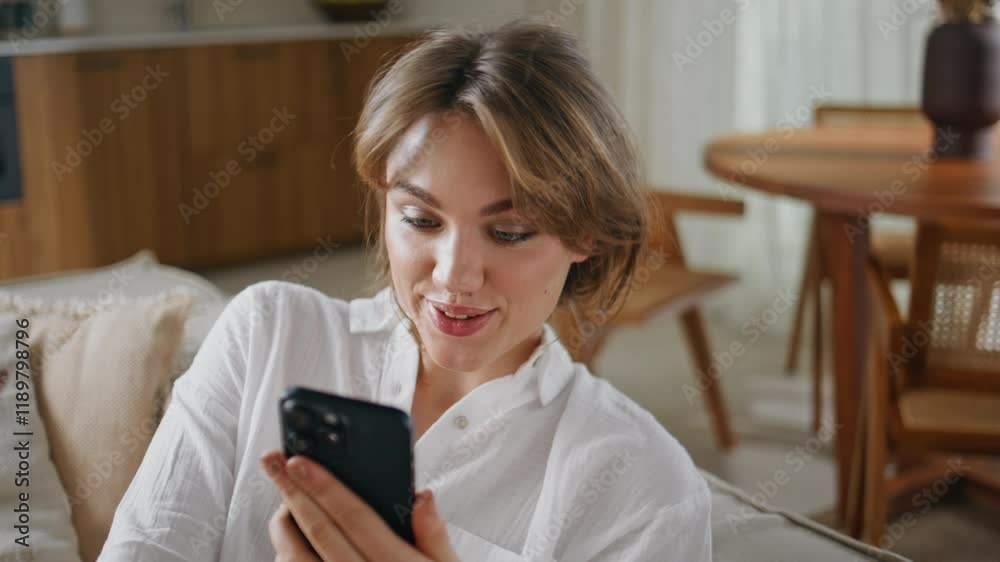 Girl video calling smartphone greeting camera in apartment closeup. Happy woman Girl video calling smartphone greeting camera in apartment closeup. Happy woman