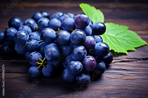 Blue grapess on wooden background. Fresh Blue grapes fruits photo