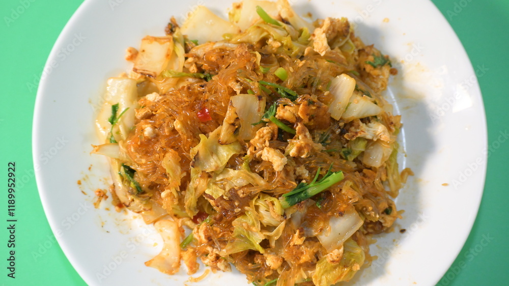 stir fried sukiyaki with egg and pork on white plate stir fried sukiyaki with egg and pork on white plate