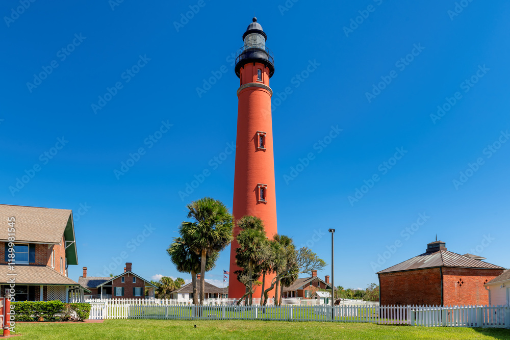 Beautiful view of the Ponce Inlet Lighthouse in sunny summer day in Daytona Beach, Florida.
