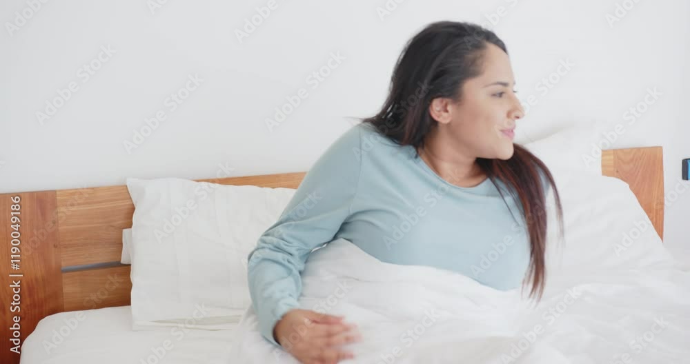 Stretching in bed, asian woman waking up and yawning in morning, at home Stretching in bed, asian woman waking up and yawning in morning, at home
