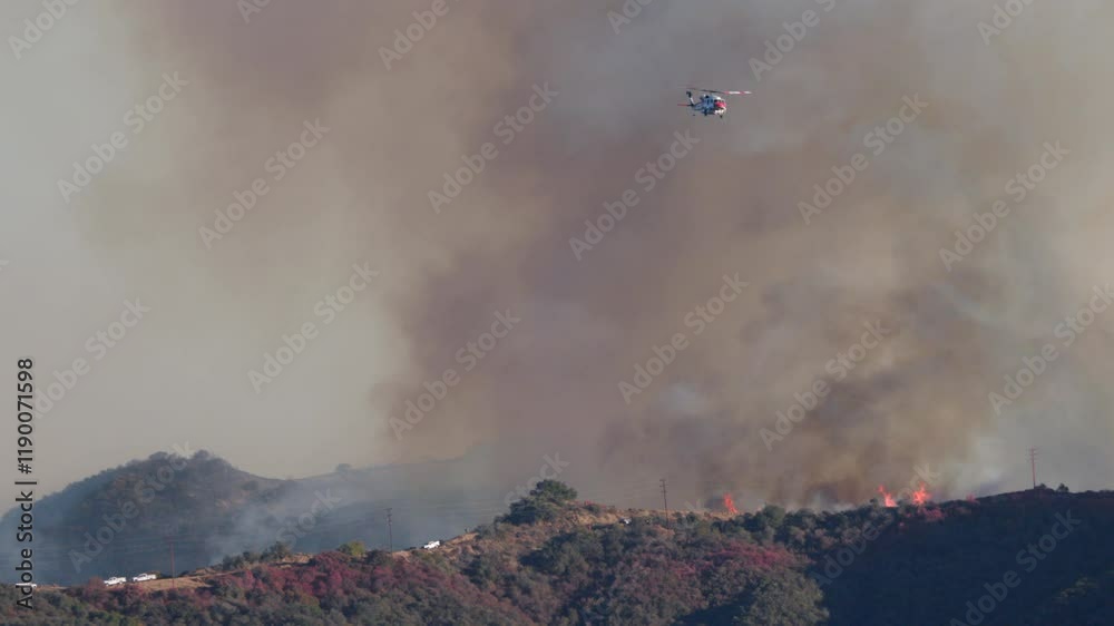 Helicopter firefighting aircraft are actively battling the raging wildfires near Los Angeles, California, showcasing the heroic efforts to save homes and protect the community from destruction