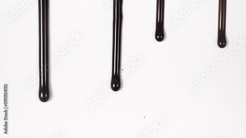 Melted warm chocolate on a white background