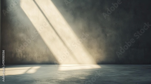 Rays of sunlight entering a space through a light channel, softly illuminating a smooth white cement wall background.