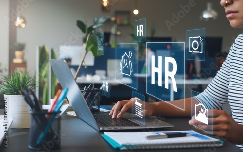 Person using laptop for human resources management
