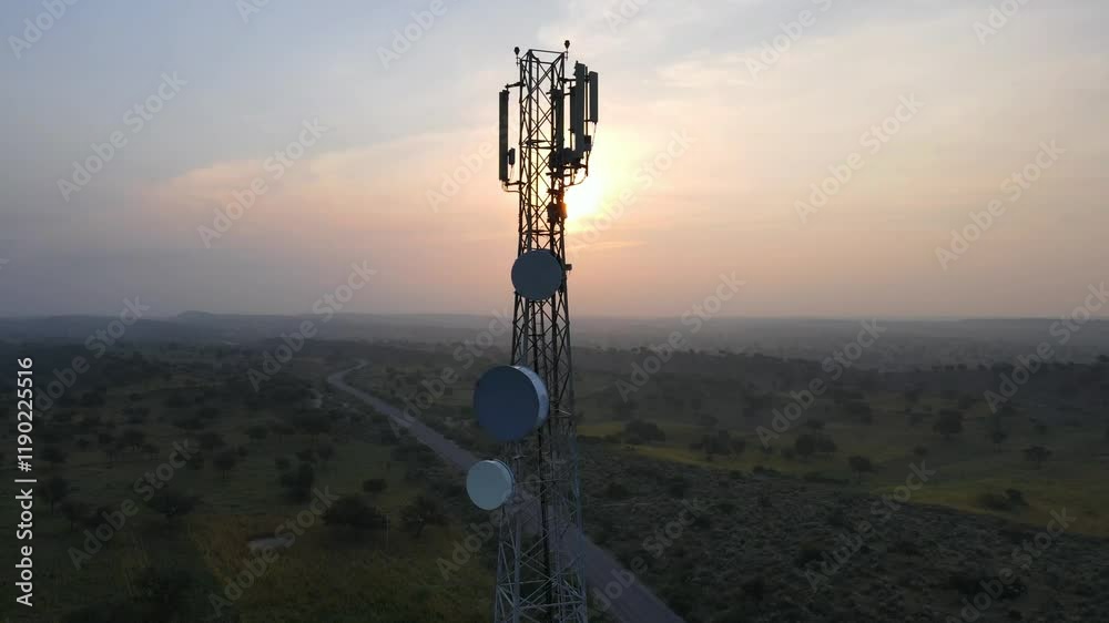 Aerial view of cell phone technology 5G, 4G signal tower at sunrise, sunset