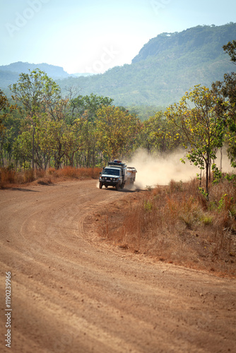 4 x 4 driving on dusty gravel road photo