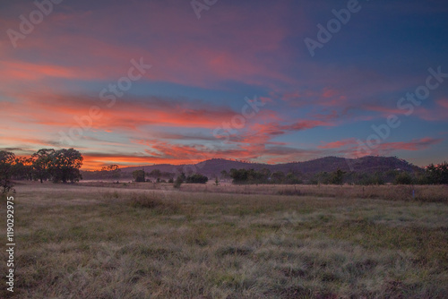 Colourful sunrise skies over a country scene photo