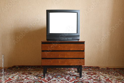 Old TV with white screen on vintage nightstand, vintage design in 80s and 90s style.
