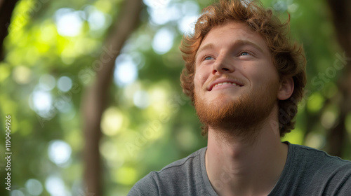 Cheerful redheaded man outdoors with natural smile. Perfect for authentic portraits, genuine happiness, or natural lifestyle content.