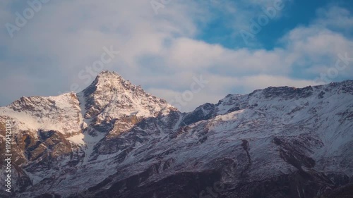 Snowy Himalayan mountain range during the sunset in winter season at Keylong in Lahaul and Spiti district, Himachal Pradesh, India. Snowy Himalayas during the winter. Natural background. photo