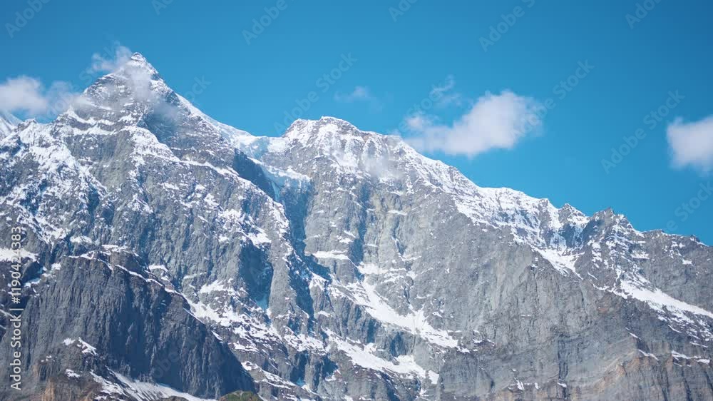 custom made wallpaper toronto digital4K shot of clouds above the snowy Himalayan mountain peaks during a sunny day after snowfall as seen from Khangsar village in Lahaul and Spiti district, Himachal Pradesh, India. Snowy Himalayas.