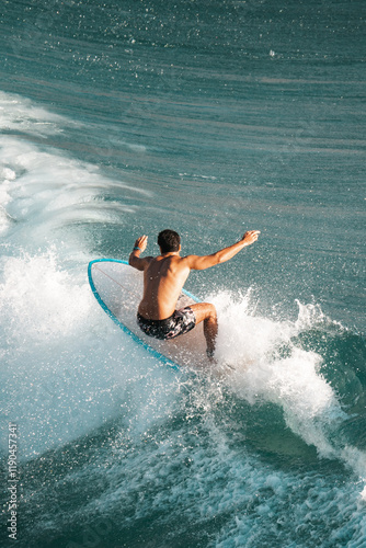 Surfing the waves, surfer catches an awesome wave on a surf board