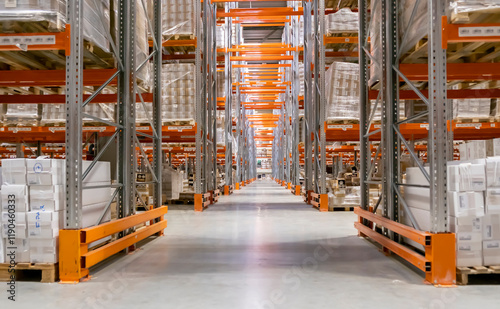 Big warehouse full of goods in cardboard boxes and packages.