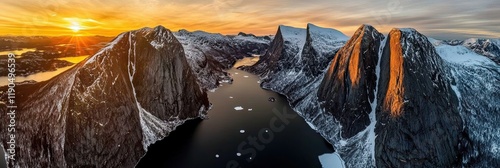 Breathtaking Sunrise Over Frozen Storvatnet Lake With Steep Peaks of Flakstadoya in Lofoten, Norway photo