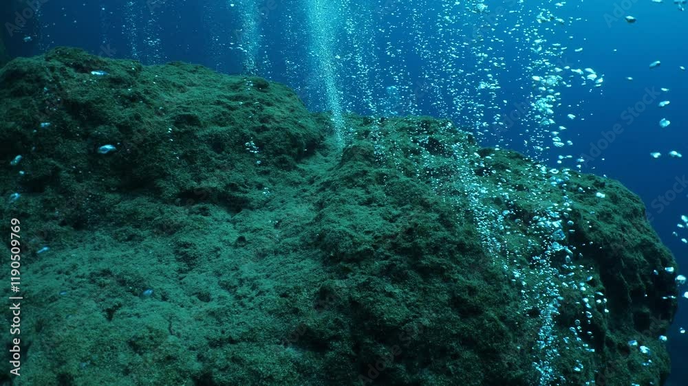 air bubbles slow  underwater coming up scenery dark blue and sun shine ocean scenery from scuba  divers backgrounds