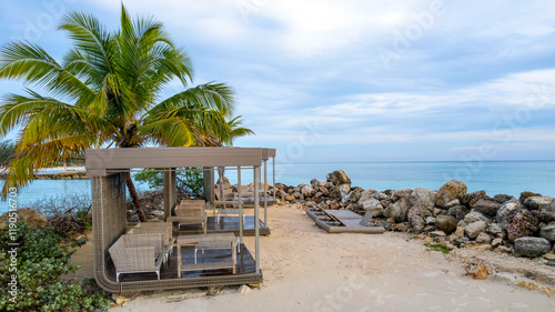 Tropical Island beach resort, with palm trees and beach chairs