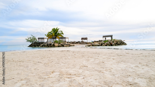 Tropical Island beach resort, with palm trees and beach chairs
