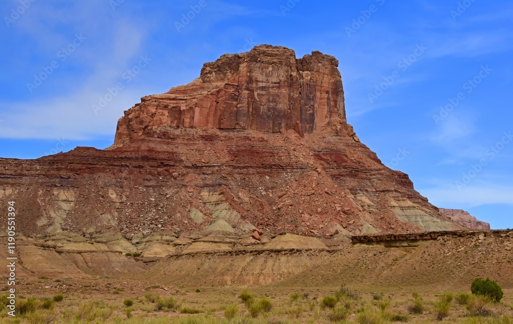 the colorful red rock butte of assembly hall peak on a sunny summer day along the buckhorn draw scenic backway in the northern san rafael swell near green river, utah the colorful red rock butte of assembly hall peak on a sunny summer day along the buckhorn draw scenic backway in the northern san rafael swell near green river, utah