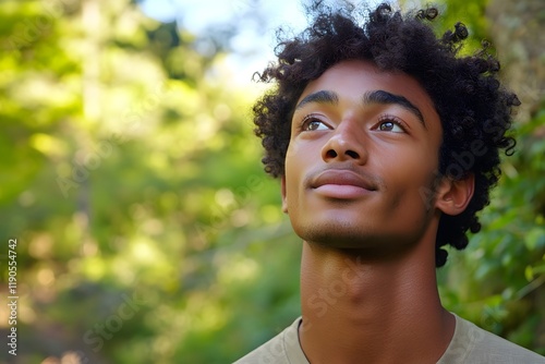 Hopeful Young Man Looking Up in Nature