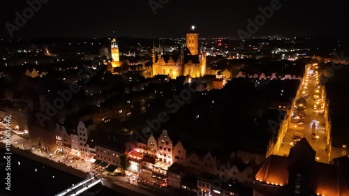 View from the drone on the old town of Gdansk on the Moltawa River at night