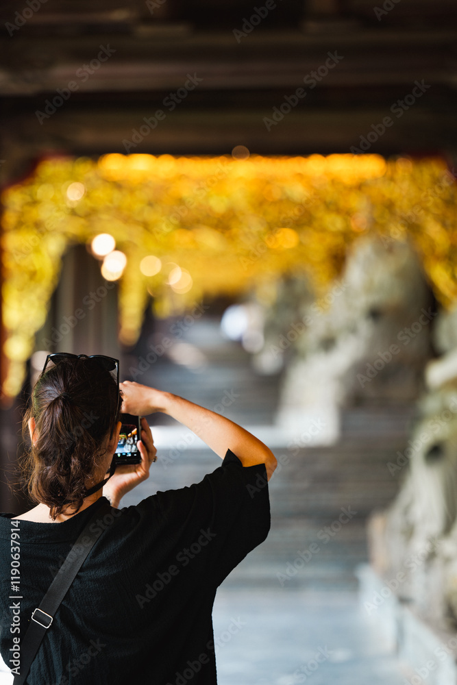 Stunning view of a tourist taking pictures at the Bai Dinh Temple. Bai Dinh Pagoda in Ninh Binh Vietnam is one of the largest pagoda complexes in Southeast Asia.