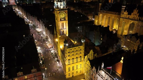 A majestic drone view of the St. Mary's Basilica in Gdańsk at night