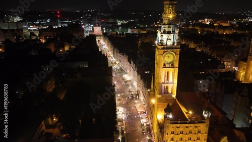 A majestic drone view of the St. Mary's Basilica in Gdańsk at night