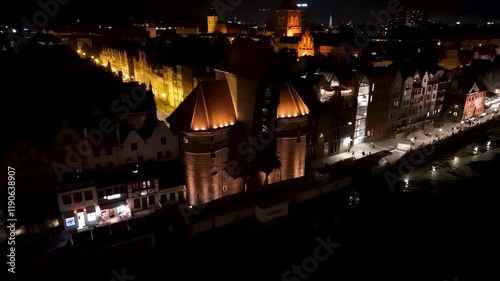 View from the drone on the old town of Gdansk on the Moltawa River at night


