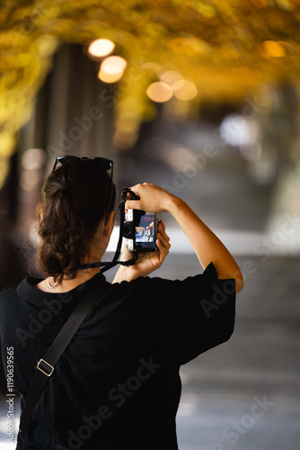 Obraz na płótnie Stunning view of a tourist taking pictures at the Bai Dinh Temple. Bai Dinh Pagoda in Ninh Binh Vietnam is one of the largest pagoda complexes in Southeast Asia. w salonie