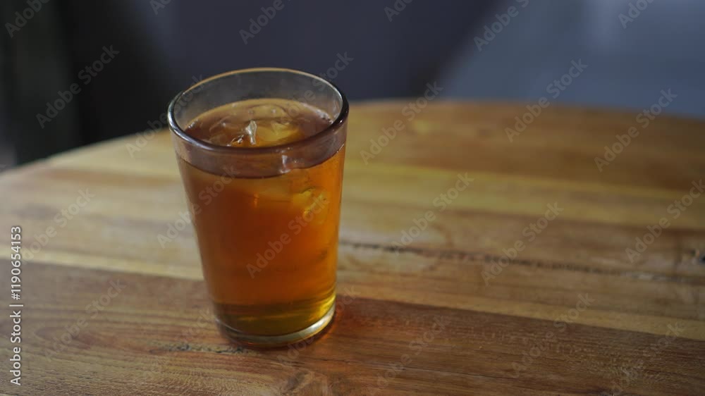 Two glasses of Ocha tea are served on the restaurant table and ready to drink. Two glasses of Ocha tea are served on the restaurant table and ready to drink.