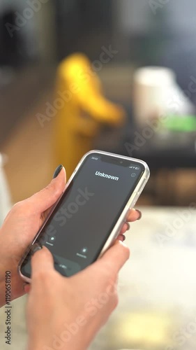 Unknown call from scammers on a mobile phone. Vertical video.