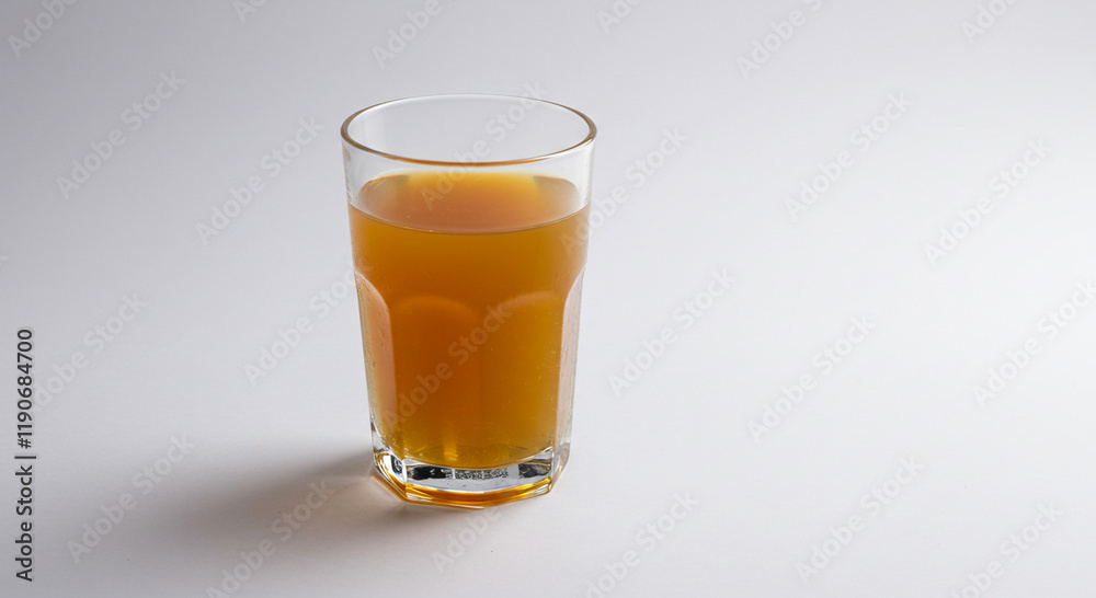 Refreshing Amber Drink in Glass Studio Shot Refreshing Amber Drink in Glass Studio Shot