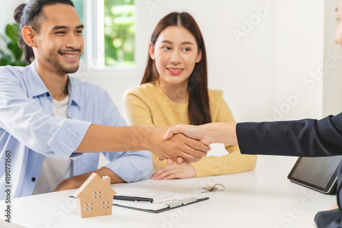 two business people shaking hands after contract is done.