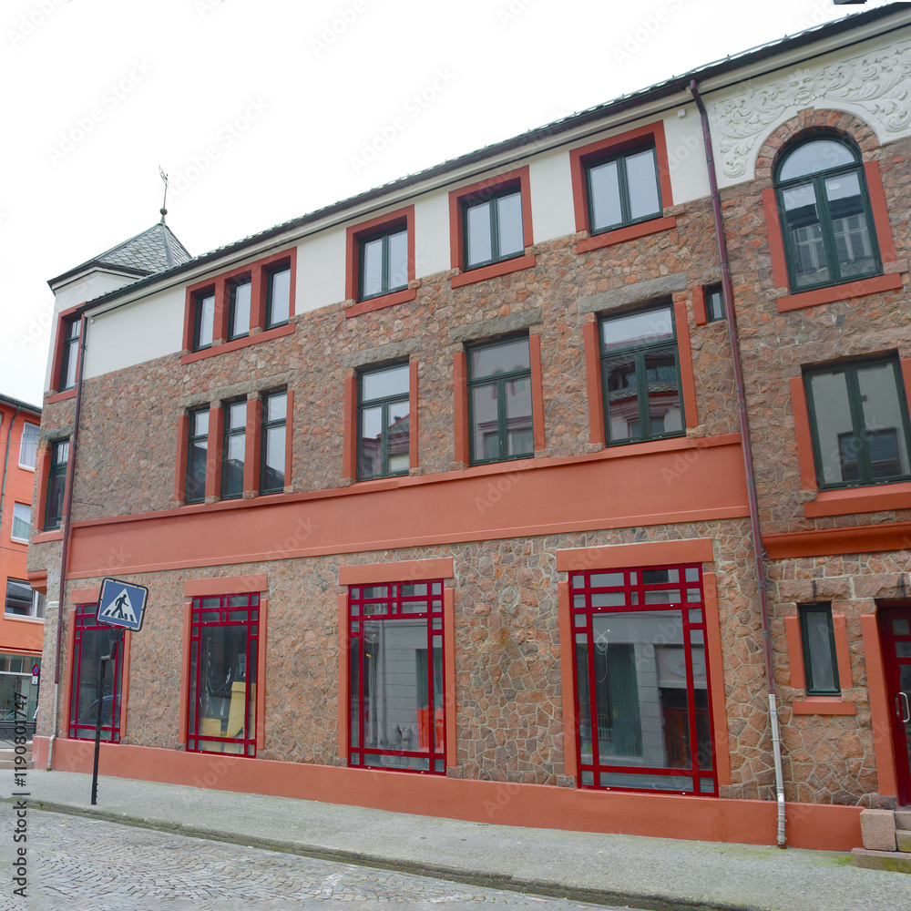 Obraz premium Building in Alesund city on a summer day, Norway. View of colorful Art Nouveau architecture port