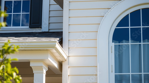 Elegant Home Exterior: Modern Architecture and Design. High-quality siding, windows, and roof showcase curb appeal and architectural details. photo